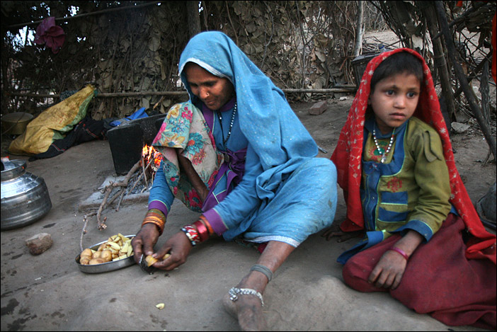 Woman cutting potatoes in Rajasthan